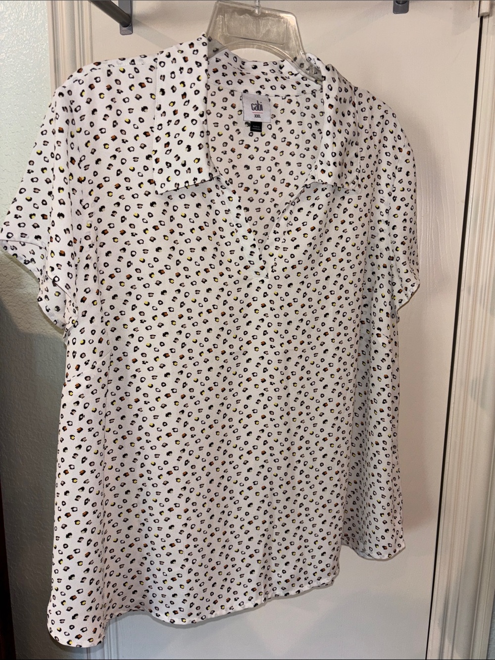 CAbi Pebble Top | Light Short Sleeve Polo Blouse with Black & Gold Spot Pattern